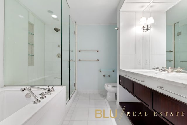 bathroom with tile patterned flooring, a shower stall, toilet, a garden tub, and vanity