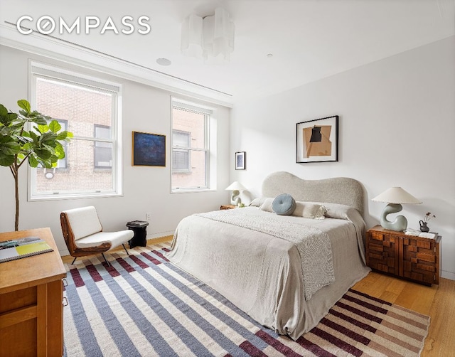 bedroom with wood finished floors