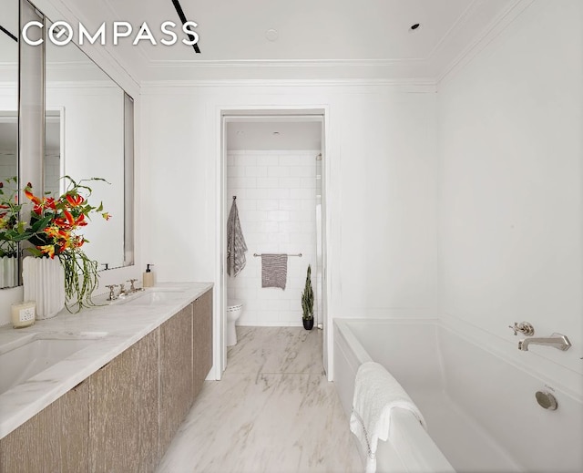 full bath featuring marble finish floor, ornamental molding, a sink, and toilet