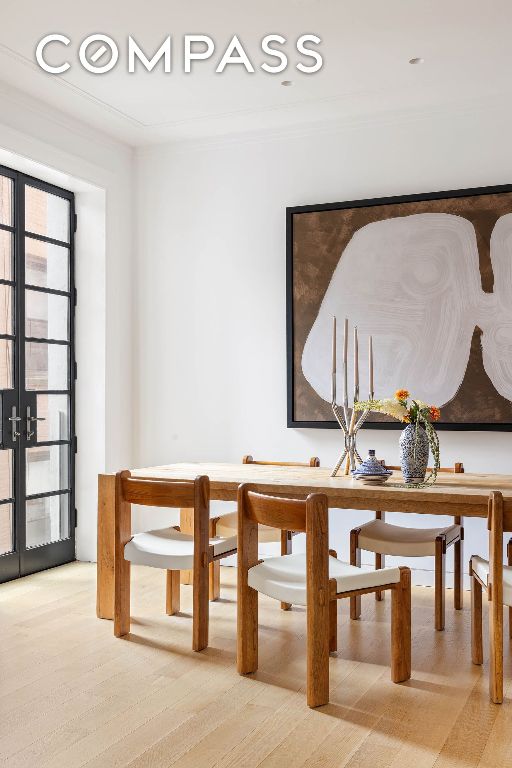 dining space with french doors, recessed lighting, wood finished floors, and crown molding