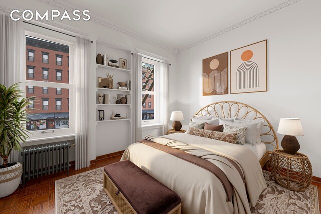 bedroom featuring radiator and parquet floors