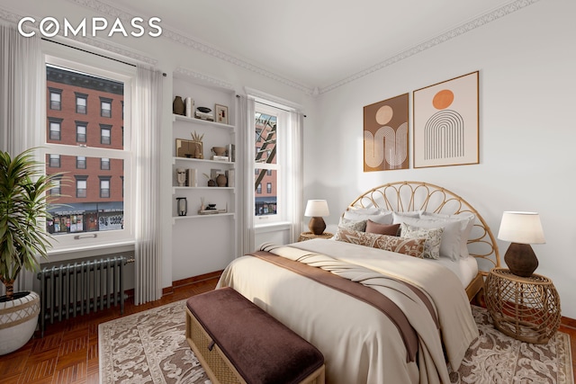 bedroom with ornamental molding and radiator
