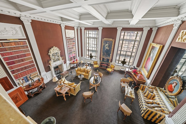 322 E 57th St Unit 12/13B, New York City, NY 10022 - living area with decorative columns, beamed ceiling, carpet flooring, coffered ceiling, and ornamental molding
