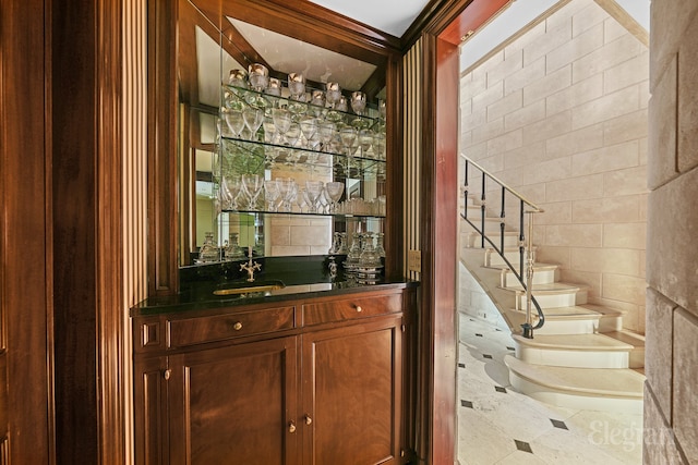 322 E 57th St Unit 12/13B, New York City, NY 10022 - indoor wet bar featuring tile walls and stairway