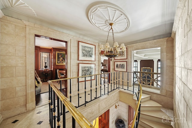 322 E 57th St Unit 12/13B, New York City, NY 10022 - stairway with a chandelier and crown molding