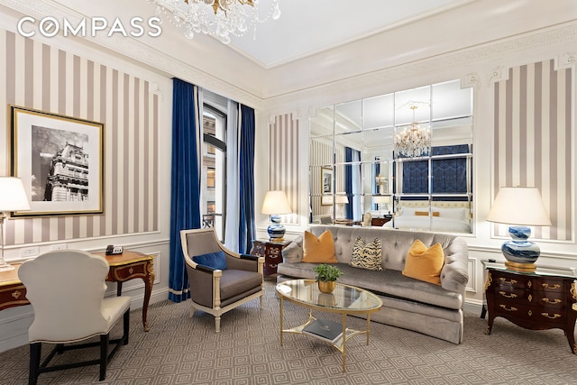 living area with carpet floors, a notable chandelier, and wallpapered walls