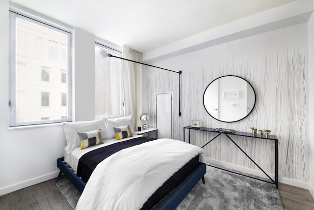 bedroom with dark wood-type flooring