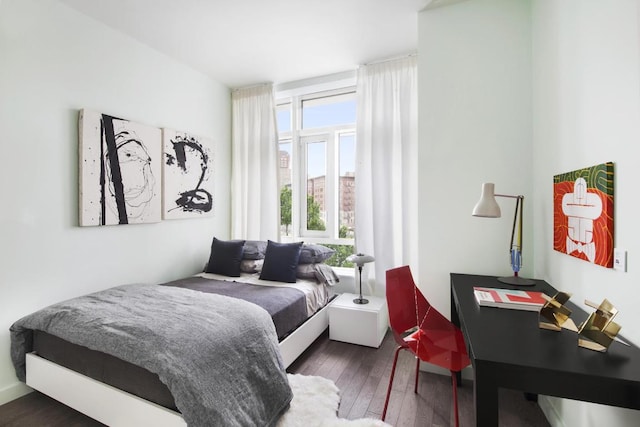 bedroom featuring dark wood-type flooring