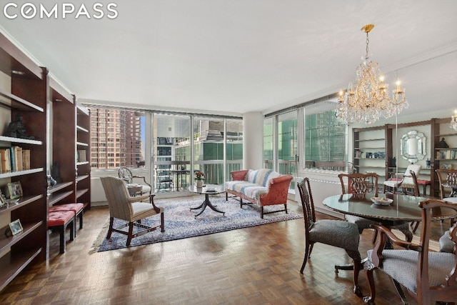 interior space with dark parquet floors, crown molding, and a chandelier