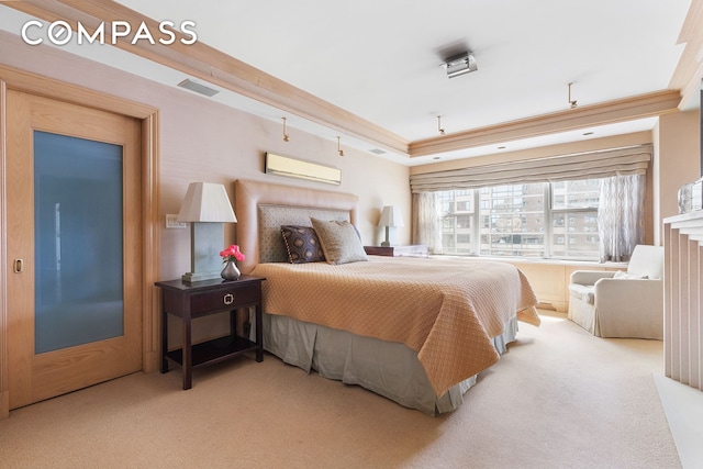 carpeted bedroom with visible vents, crown molding, and a wall unit AC