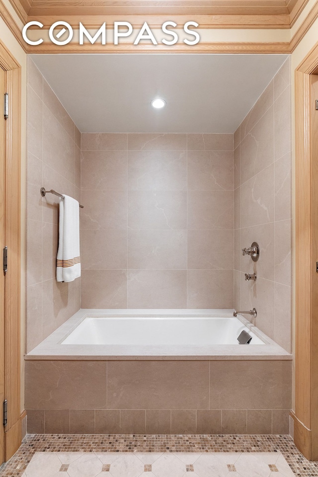 bathroom featuring tiled bath and tile walls