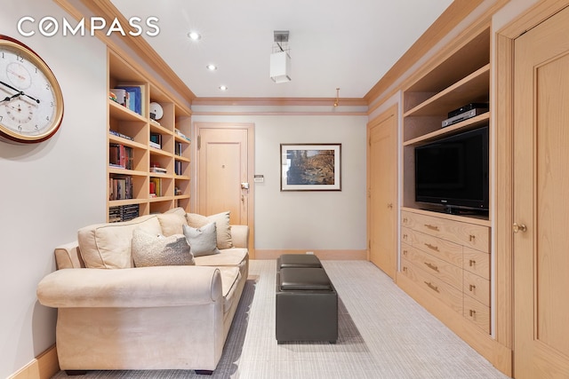 sitting room featuring built in features, recessed lighting, crown molding, and baseboards