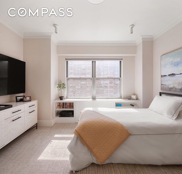 bedroom featuring carpet floors and crown molding