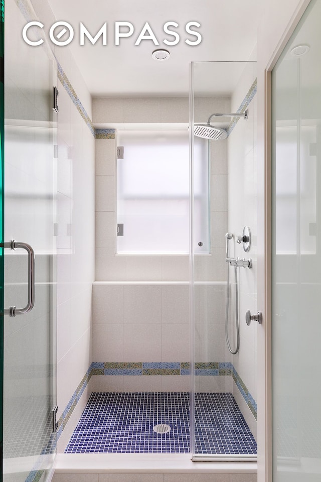 bathroom with a stall shower