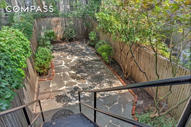 view of patio featuring a fenced backyard