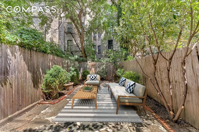 view of patio featuring a fenced backyard and an outdoor living space