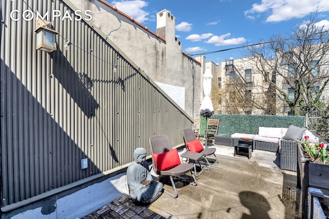 view of patio with fence and an outdoor living space