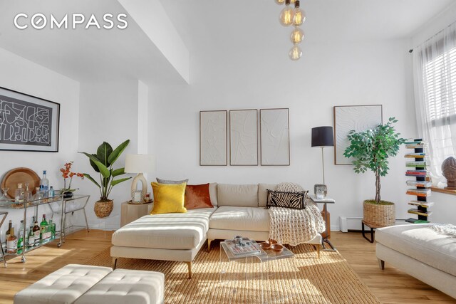 living room with light hardwood / wood-style flooring