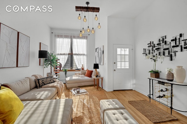 living room featuring wood finished floors and baseboards