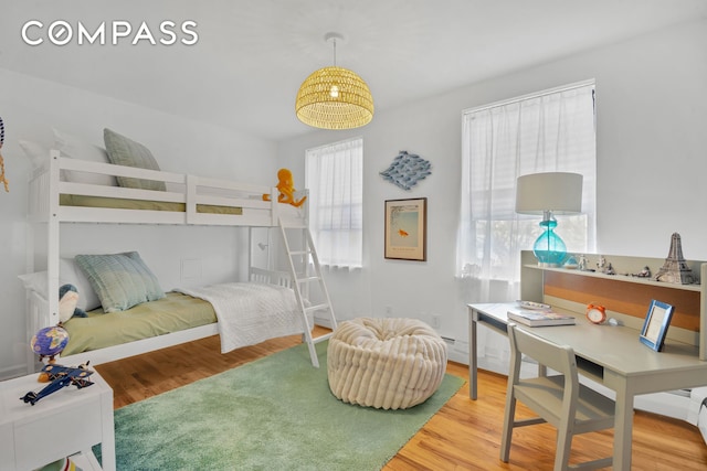 bedroom featuring wood finished floors