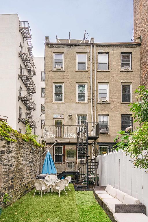 rear view of house featuring a yard