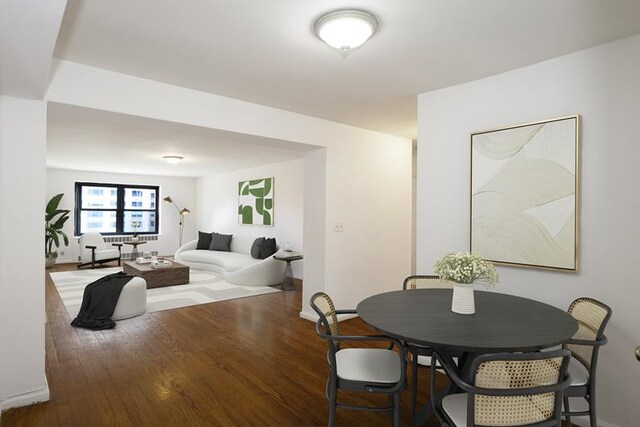 dining area featuring wood-type flooring