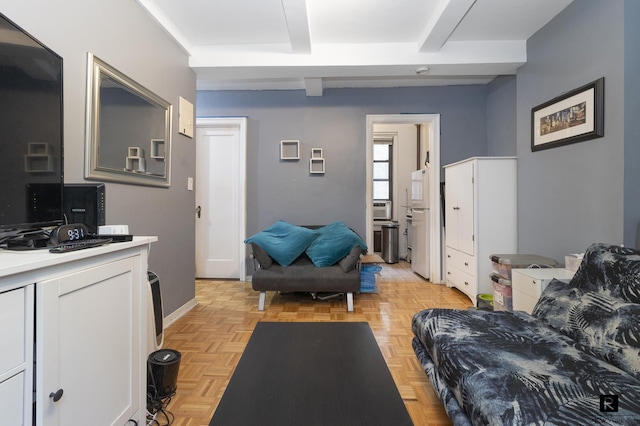 living area featuring beamed ceiling, baseboards, and cooling unit