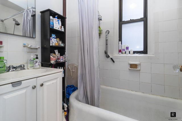 226-230 E 12th St Unit 5-G, New York City, NY 10003 - bathroom with vanity, shower / bath combo, and tile walls