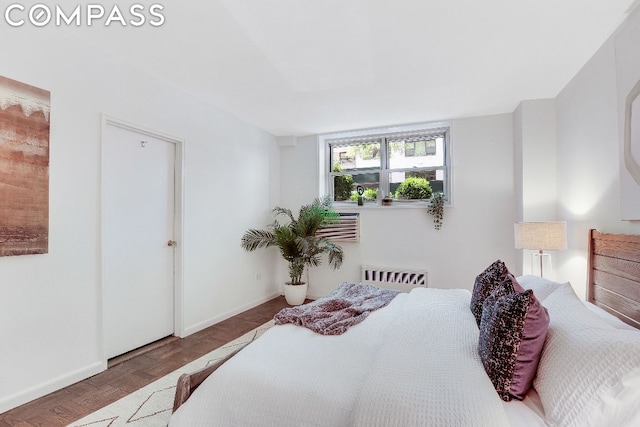 bedroom featuring dark parquet floors