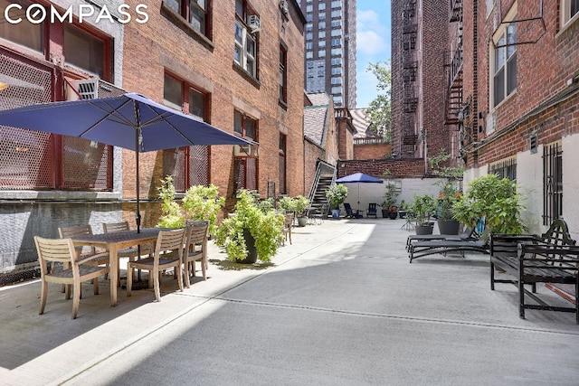 surrounding community featuring a patio area