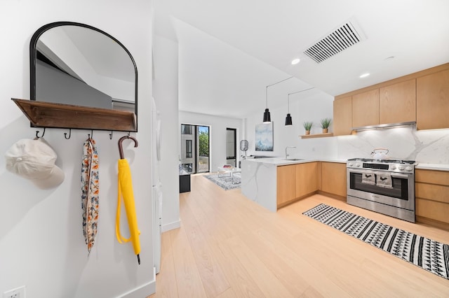 30-05 Vernon Blvd Unit 5-E, New York City, NY 11102 - kitchen with stainless steel gas stove, open shelves, light brown cabinets, light wood-style flooring, and recessed lighting