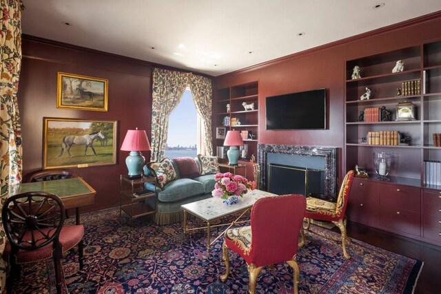 bedroom with crown molding and light carpet