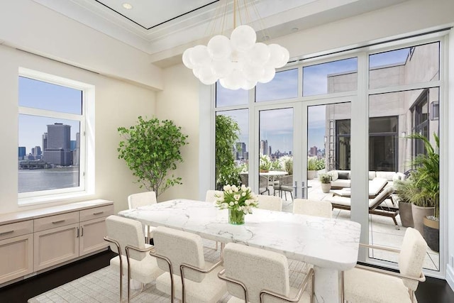 sunroom featuring an inviting chandelier and a healthy amount of sunlight