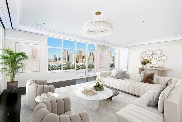 living room featuring an inviting chandelier, crown molding, and hardwood / wood-style floors