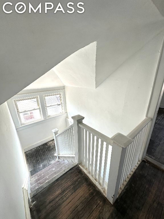 stairs with hardwood / wood-style flooring