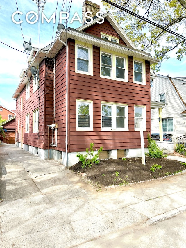 view of home's exterior featuring concrete driveway