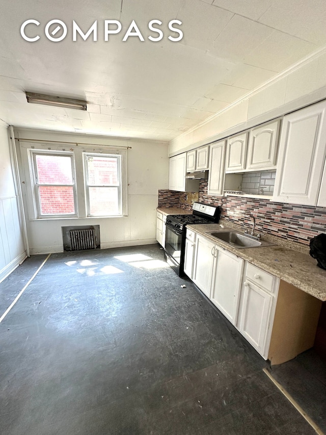 kitchen featuring radiator, white cabinetry, black range with gas stovetop, and a sink