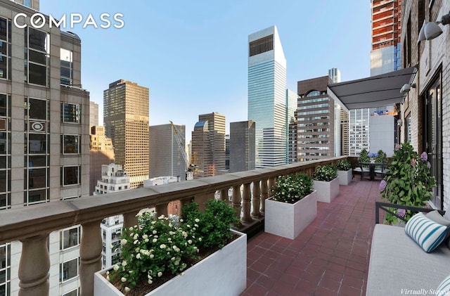 balcony featuring a view of city