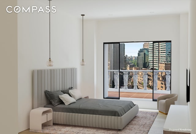 bedroom with a city view, radiator, and wood finished floors