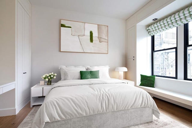 bedroom with wood finished floors