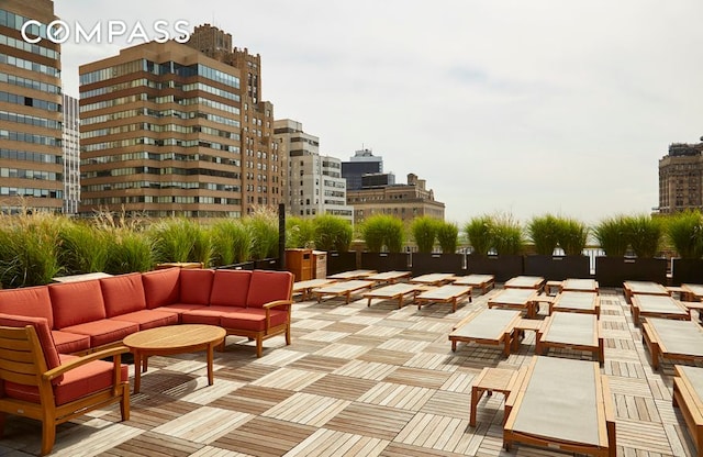 view of home's community with an outdoor hangout area and a city view