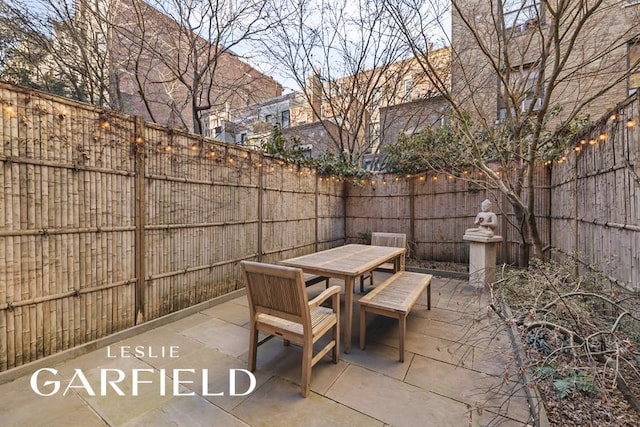 view of patio / terrace featuring outdoor dining space and a fenced backyard