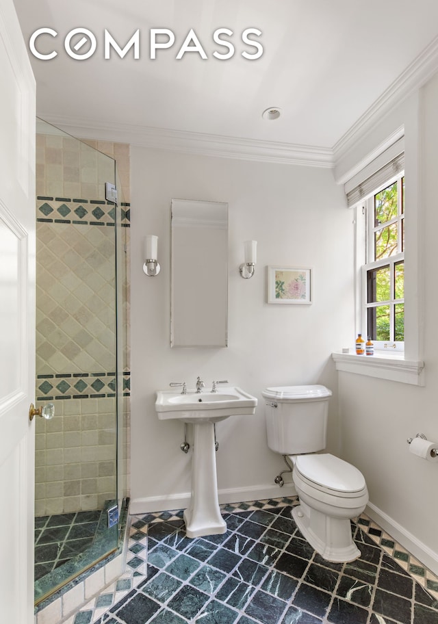 24 Gramercy Park S Unit 1/2E, New York City, NY 10003 - bathroom with ornamental molding, toilet, a shower stall, and baseboards
