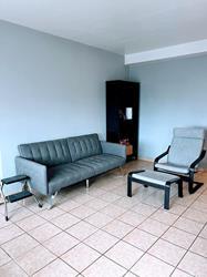 living room with light tile patterned floors