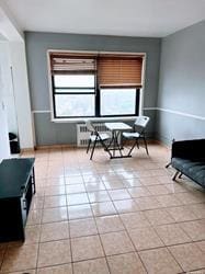 living area with light tile patterned flooring