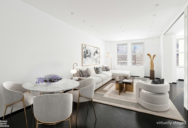 living room featuring dark parquet floors