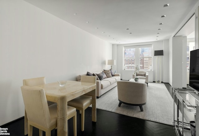 welcome area with french doors and a chandelier