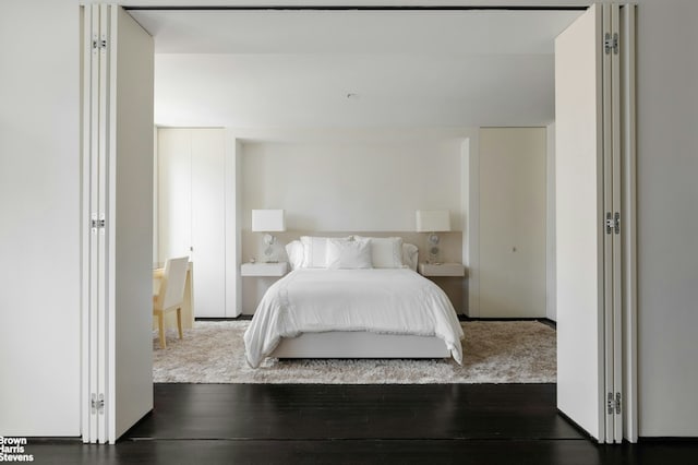 bedroom with wood finished floors