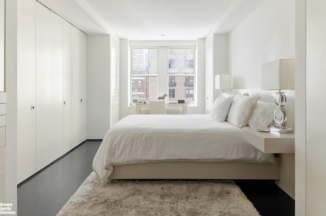 bedroom with wood finished floors