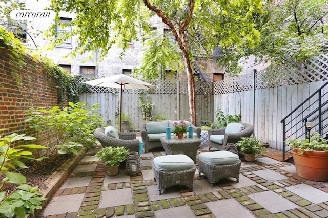 116 E 91st St, New York City, NY 10128 - fenced backyard with a patio area and outdoor lounge area